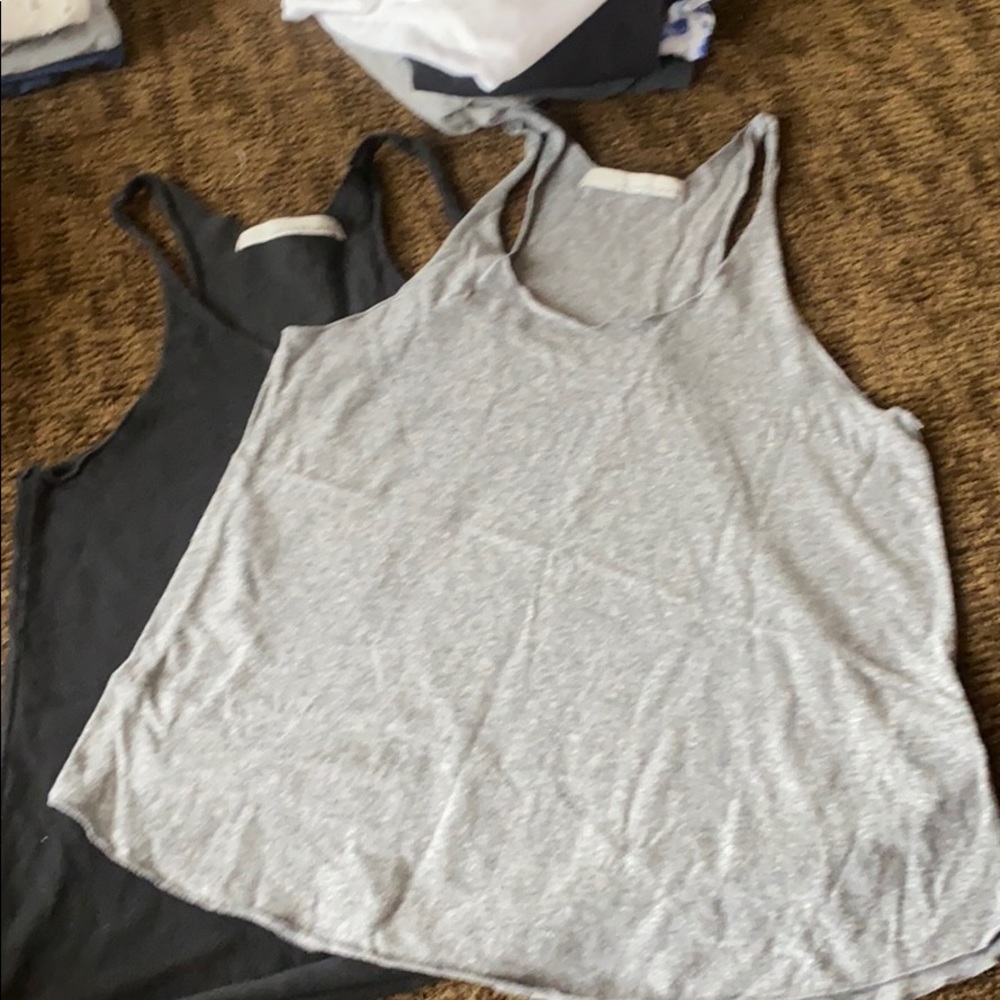 Two large Stillwater razorback tanks gray  & black